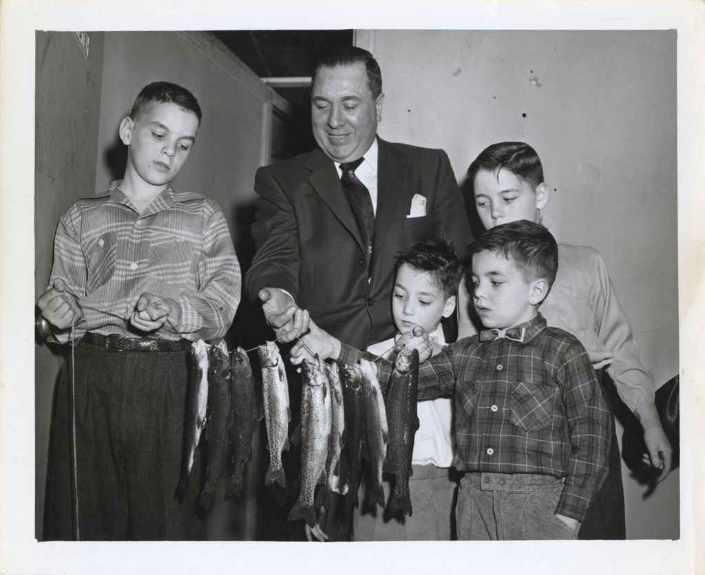 Miniature of Richard J. Daley and his sons with a string of fish