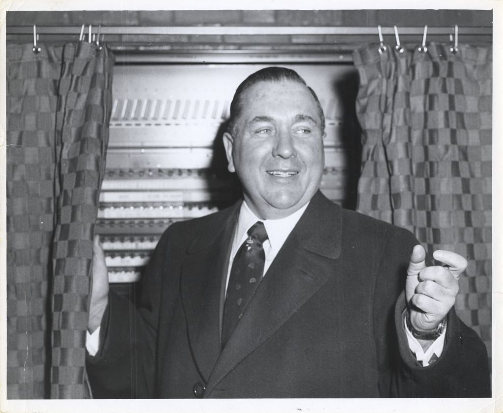 Miniature of Richard J. Daley in front of a voting machine