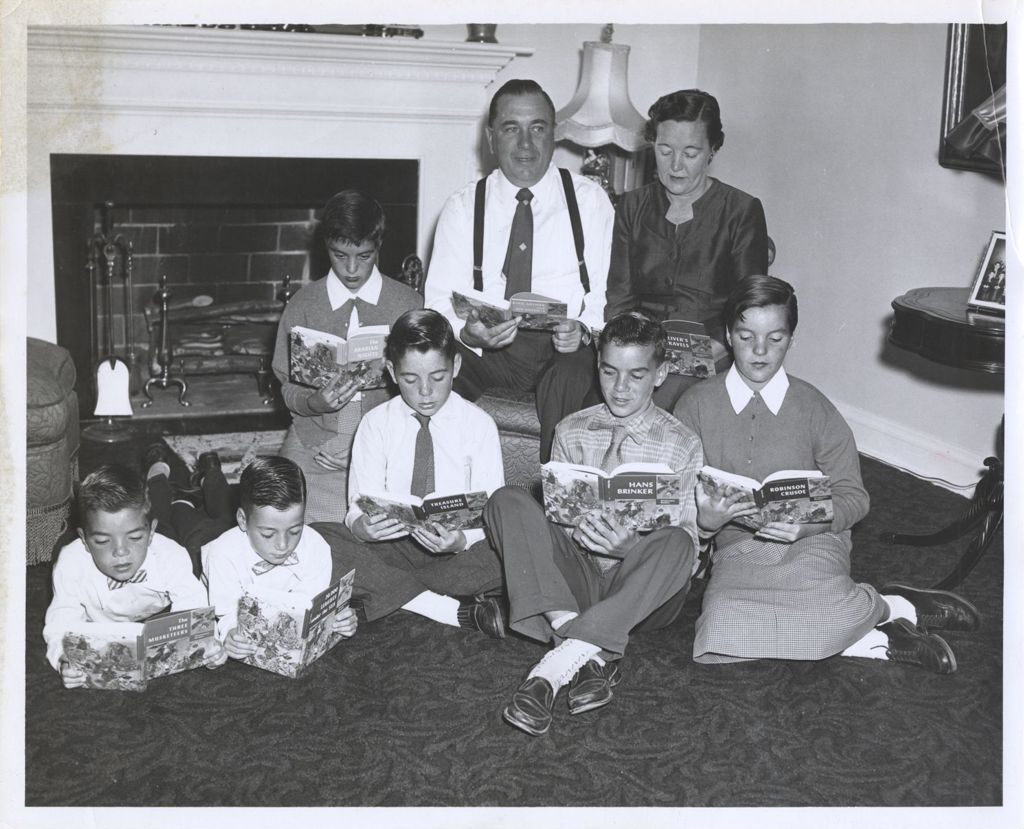 Miniature of Daley family reading books