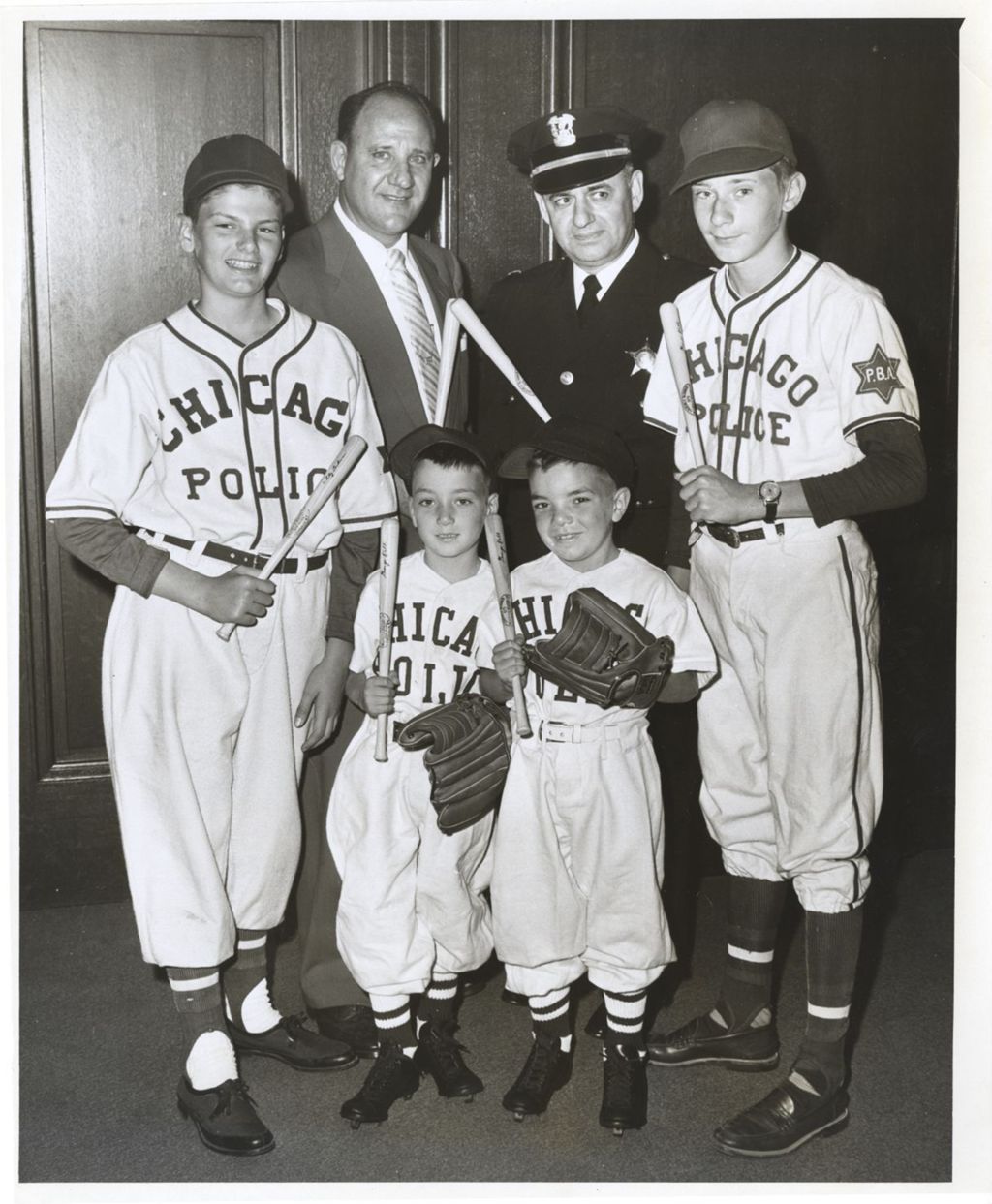 William and John Daley and others in Chicago Police baseball uniforms