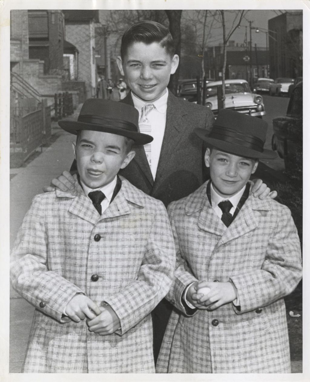 Michael, John, and William Daley outside
