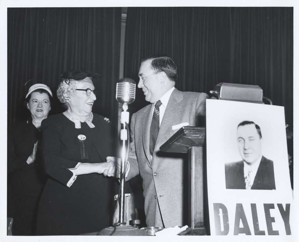 Miniature of Richard J. Daley shakes hands at a campaign event