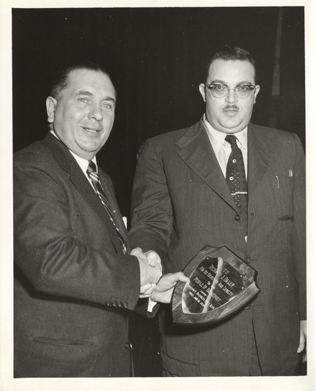 Richard J. Daley accepting a plaque