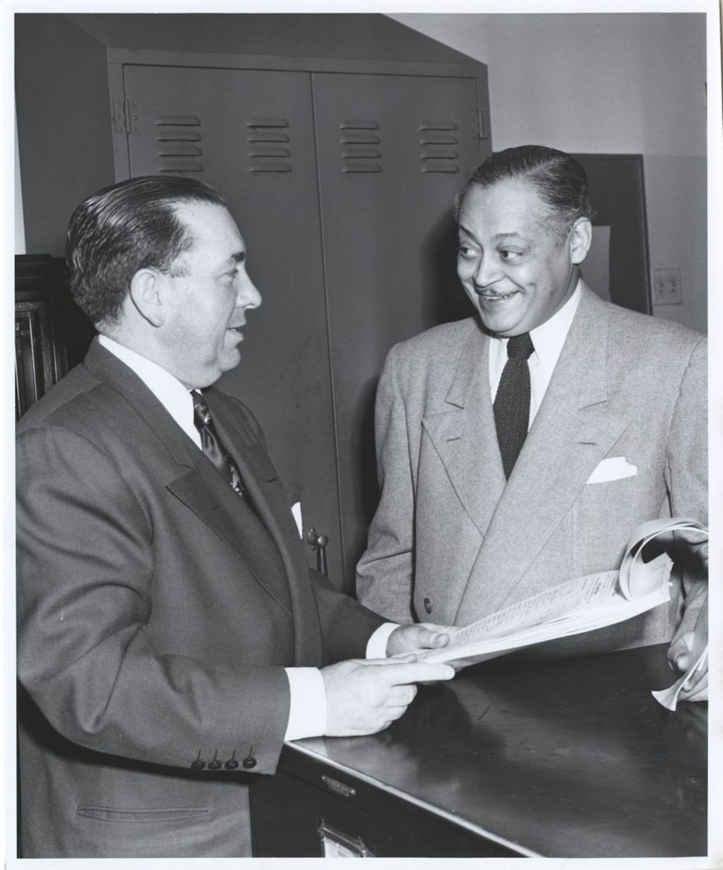 Miniature of Richard J. Daley and a man with a petition