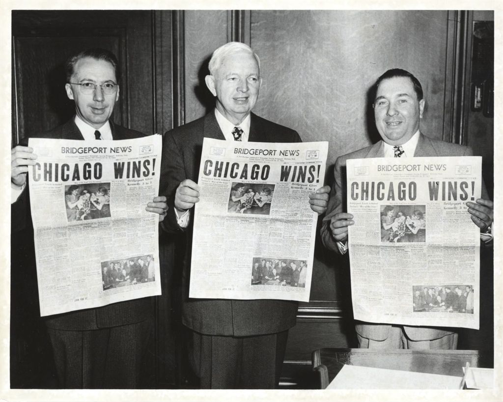Martin Kennelly, Richard J. Daley, and John Mortimer display newspapers