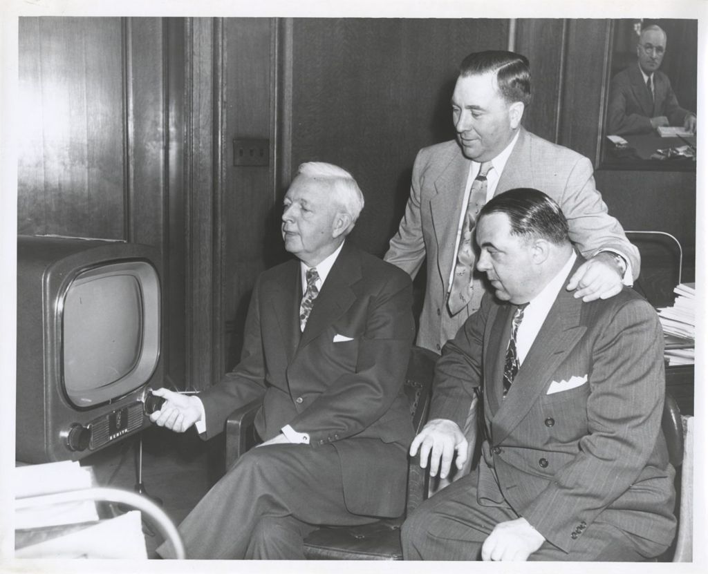 Martin Kennelly, Richard J. Daley, and Bill Milota watch television