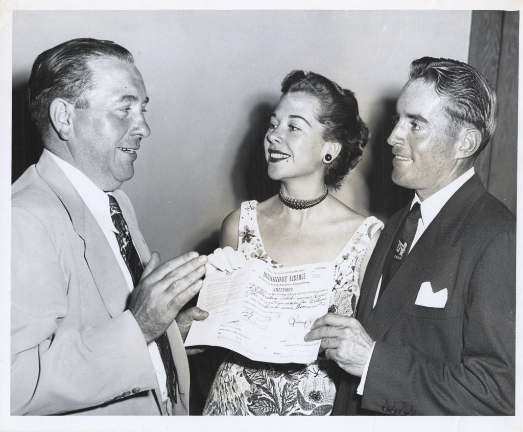 Richard J. Daley issues marriage license to Ann Williams and Frank Stranahan