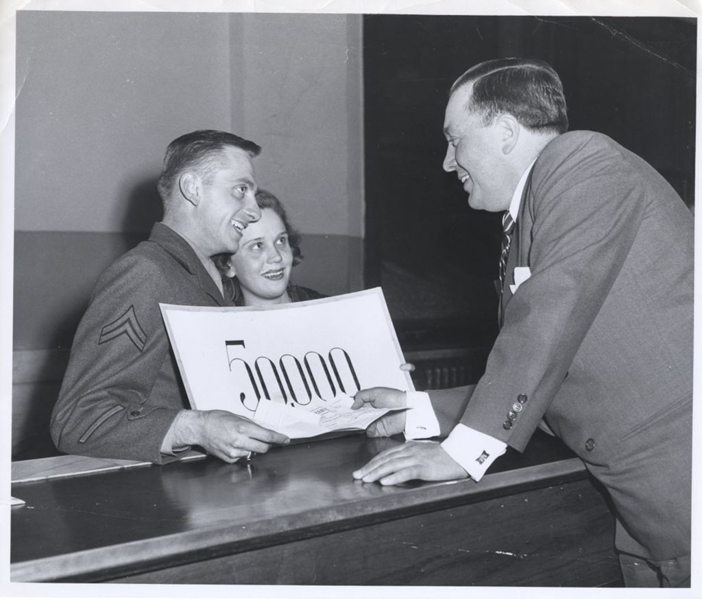 Richard J. Daley and a couple with a "50,000" sign