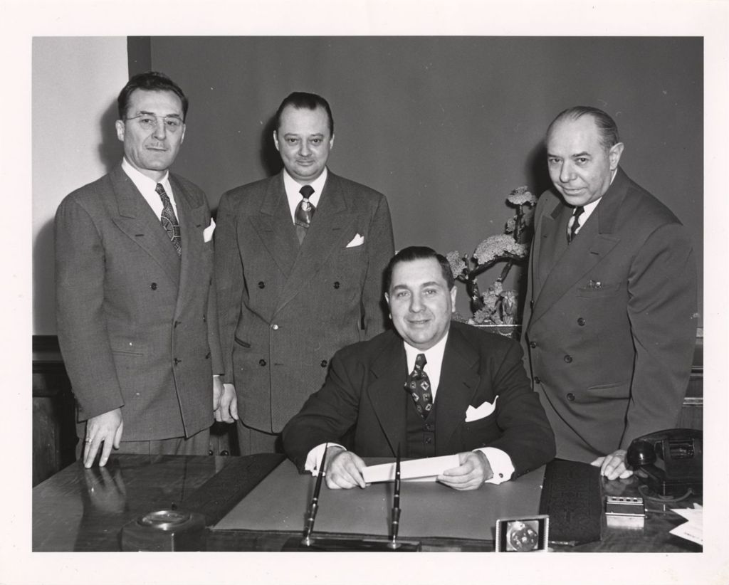 Richard J. Daley with Department of Revenue officers