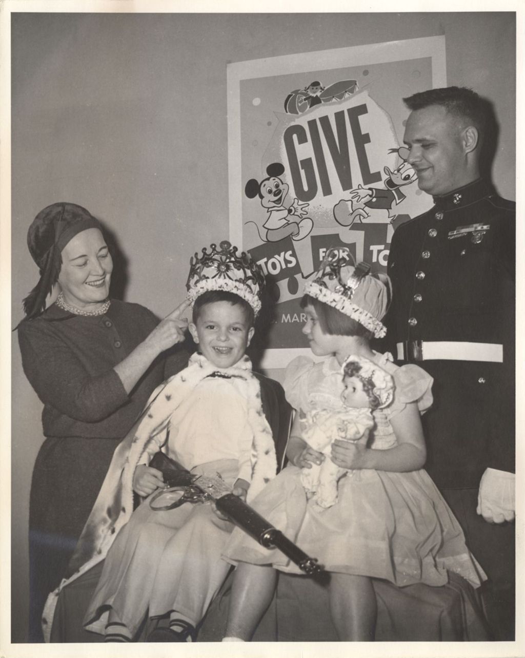 Miniature of Eleanor Daley and a Marine with children receiving toys