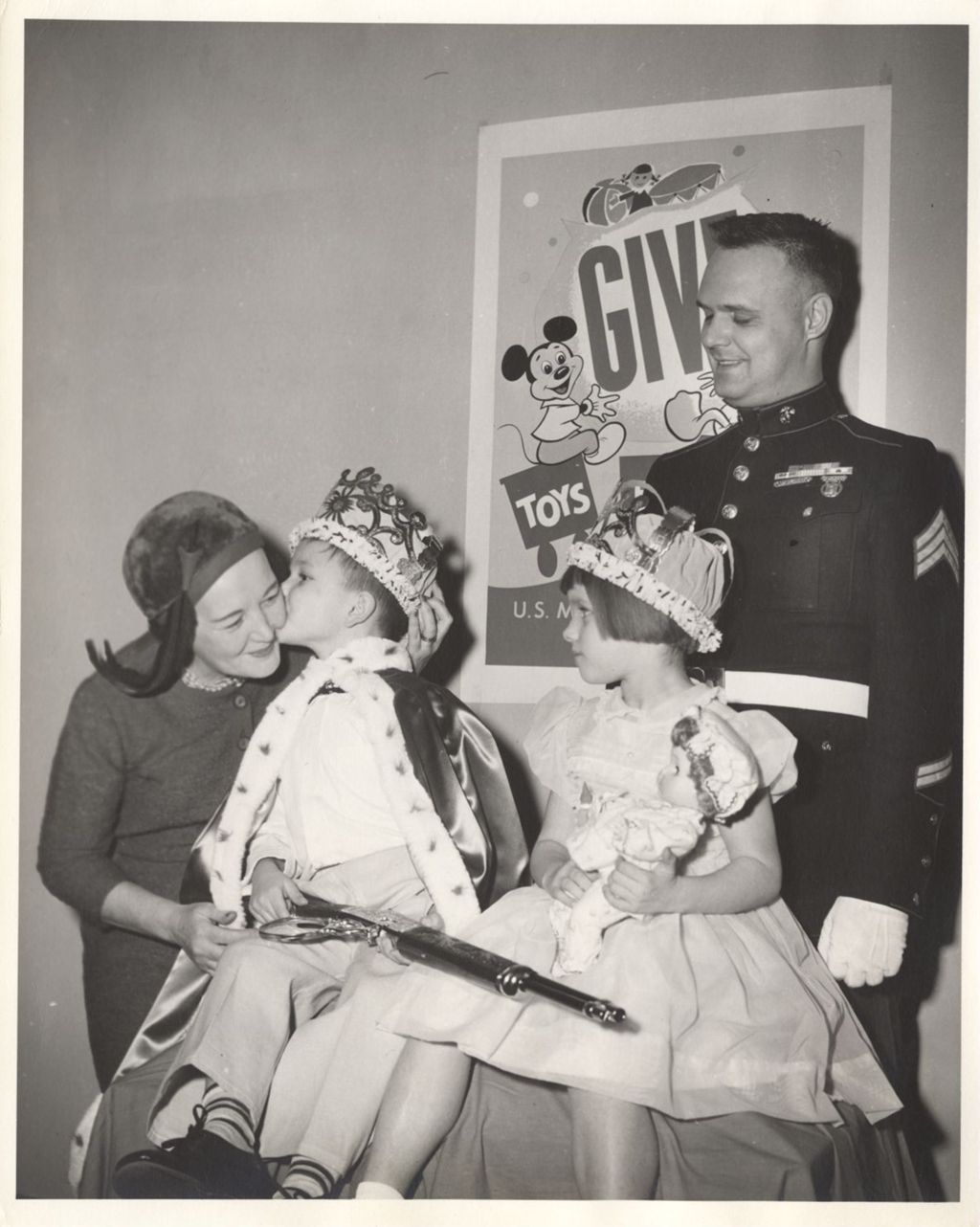 Miniature of Eleanor Daley and a Marine with children receiving toys