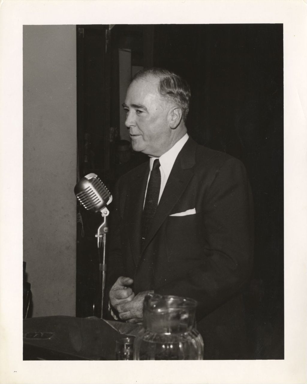 Miniature of William A. Lee at a microphone