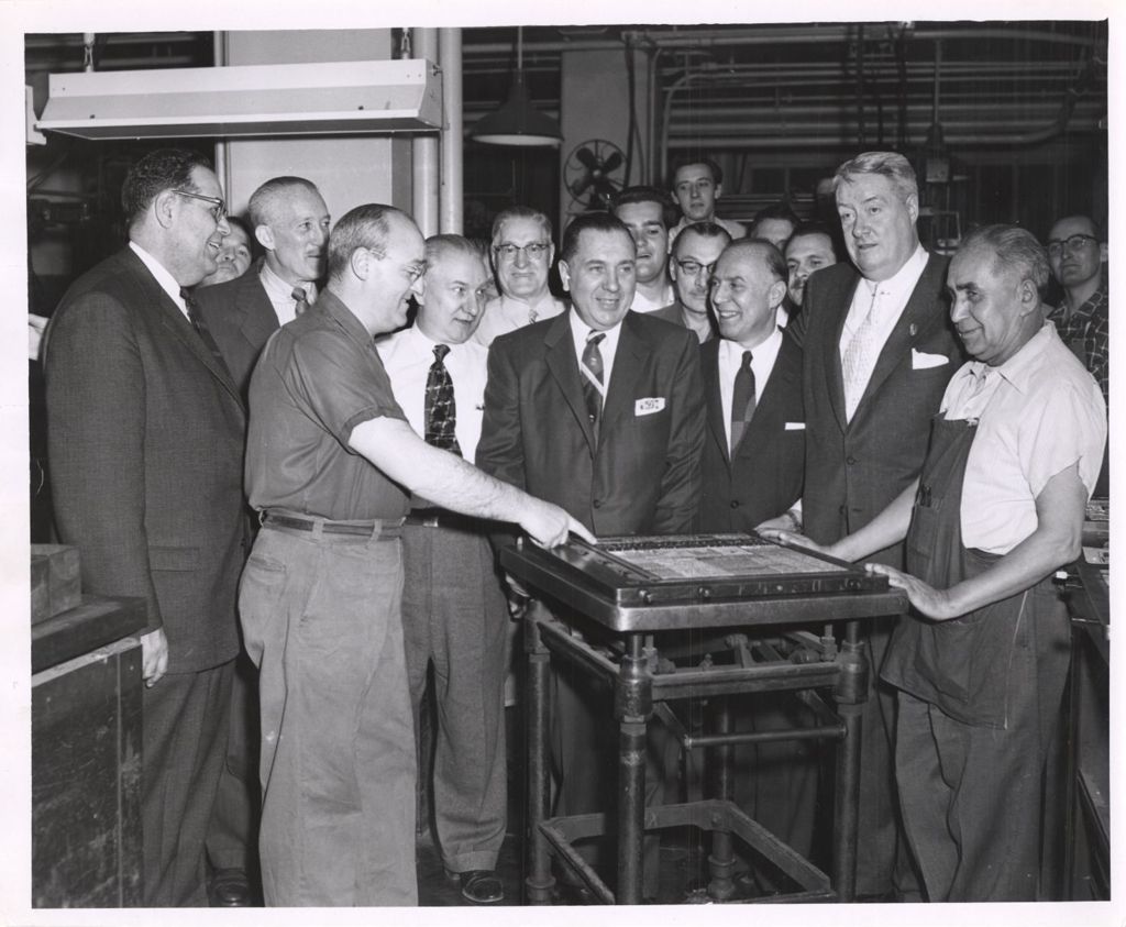 Miniature of Richard J. Daley, Abraham Lincoln Marovitz and others look at a printing plate
