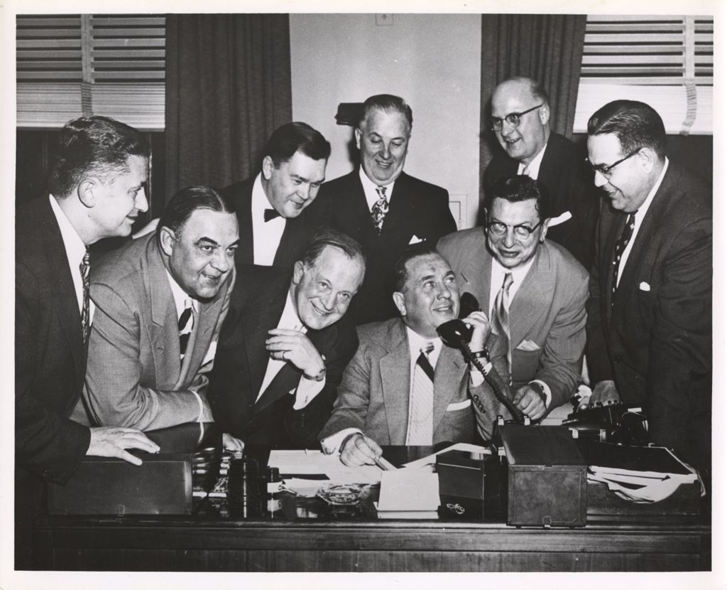 Miniature of Richard J. Daley, with others, on the telephone