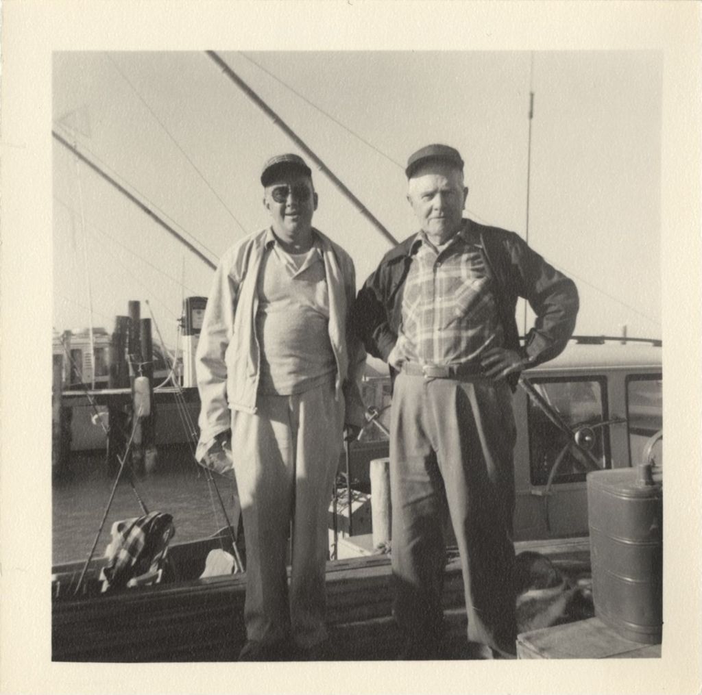 Miniature of Senator Lynch and Michael J. Daley beside a fishing boat