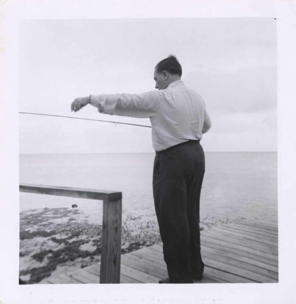 Miniature of Richard J. Daley fishing from a dock