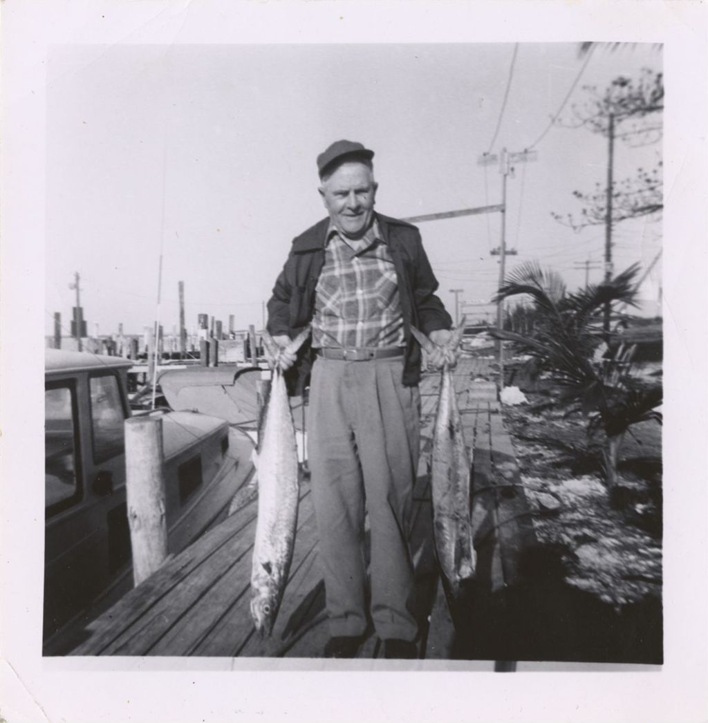 Miniature of Michael J. Daley displaying his catch