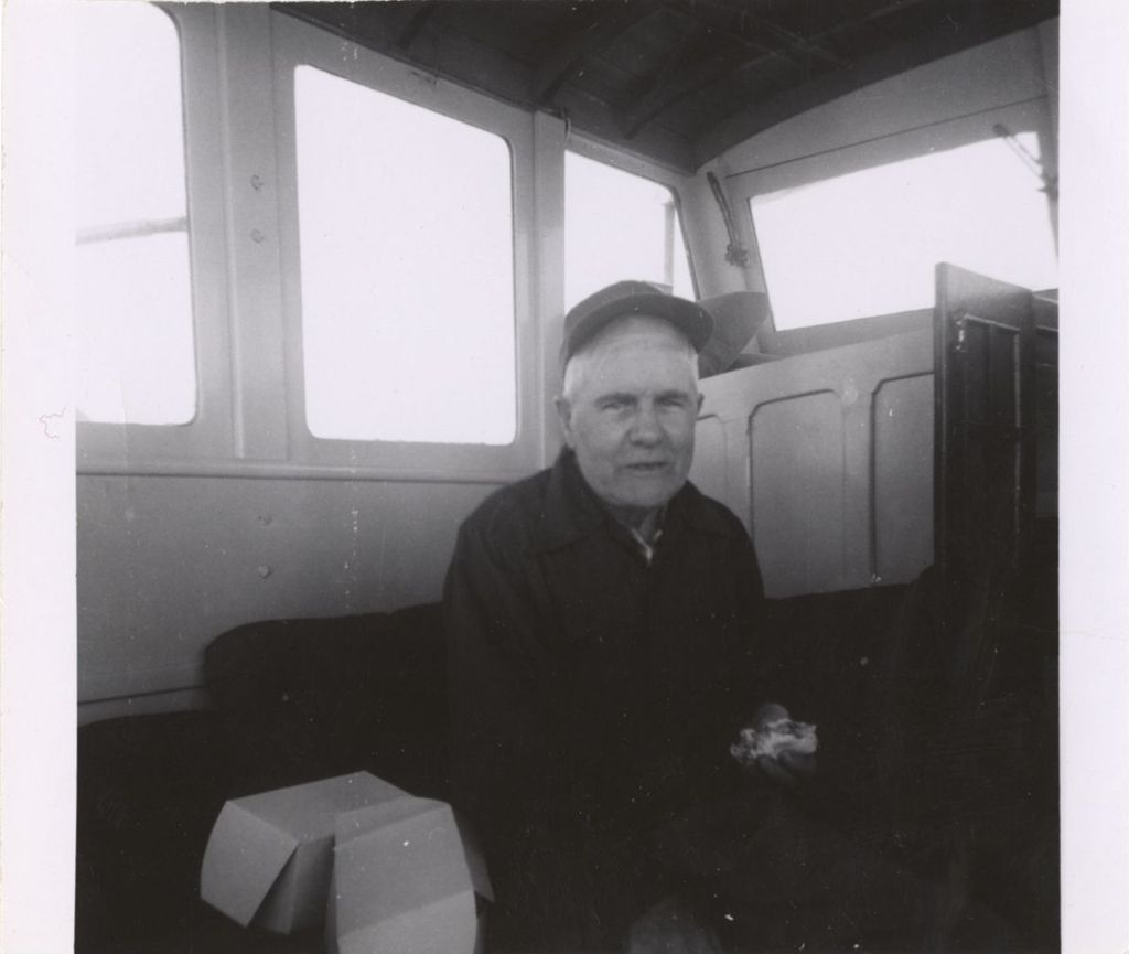 Miniature of Michael J. Daley inside a fishing boat