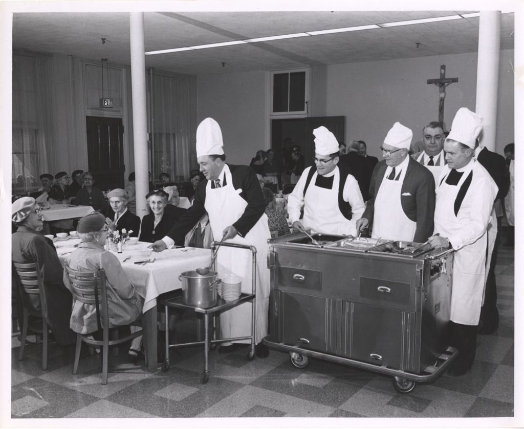 Miniature of Richard J. Daley and others serving food at a church event