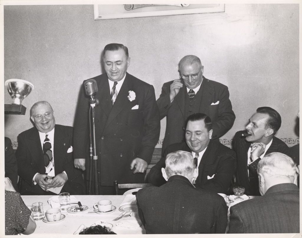 Miniature of Richard J. Daley and others listening to a man speaking