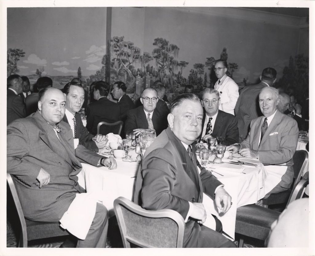 Miniature of Pat Cunningham with others at a banquet