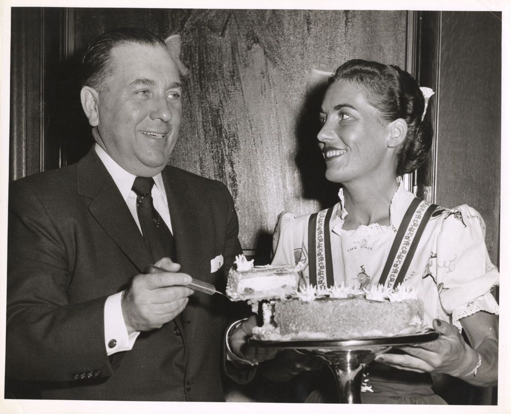 Miniature of Richard J. Daley serving a slice of cake