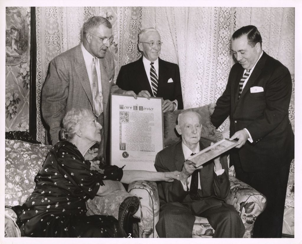 Henry B. Forster accepting an award from Richard J. Daley