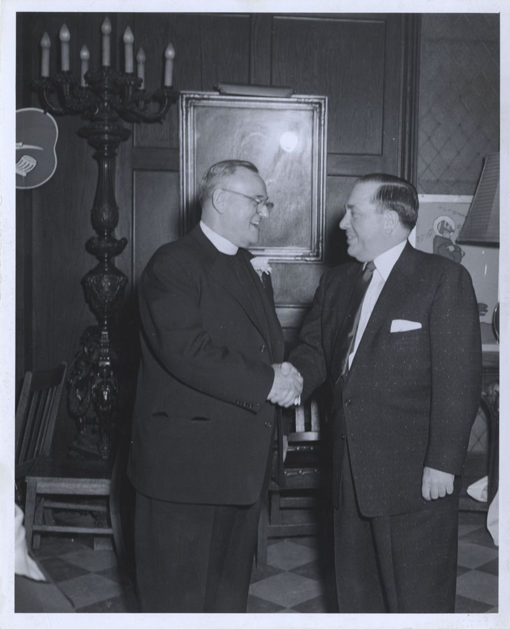 Miniature of Richard J. Daley shaking hands with a priest