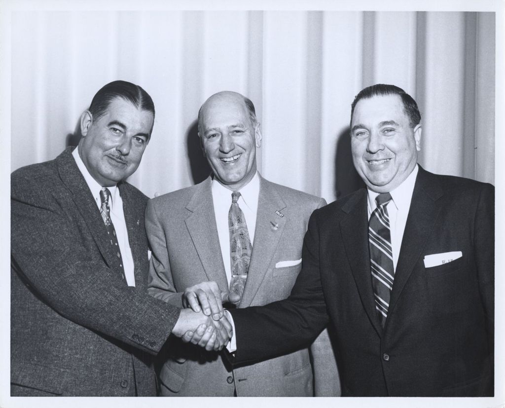 Miniature of Richard J. Daley clasping hands with others