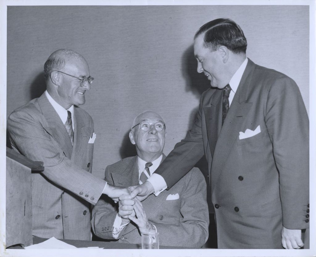Miniature of Jacob Arvey, Joseph L. Gill, and Richard J. Daley clasping hands