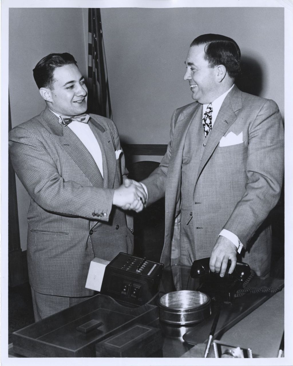 Frank Barbaro and Richard J. Daley shaking hands