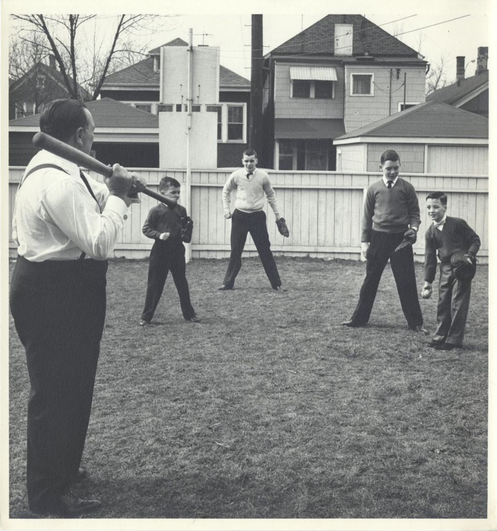 Miniature of Richard J. Daley playing baseball with his sons