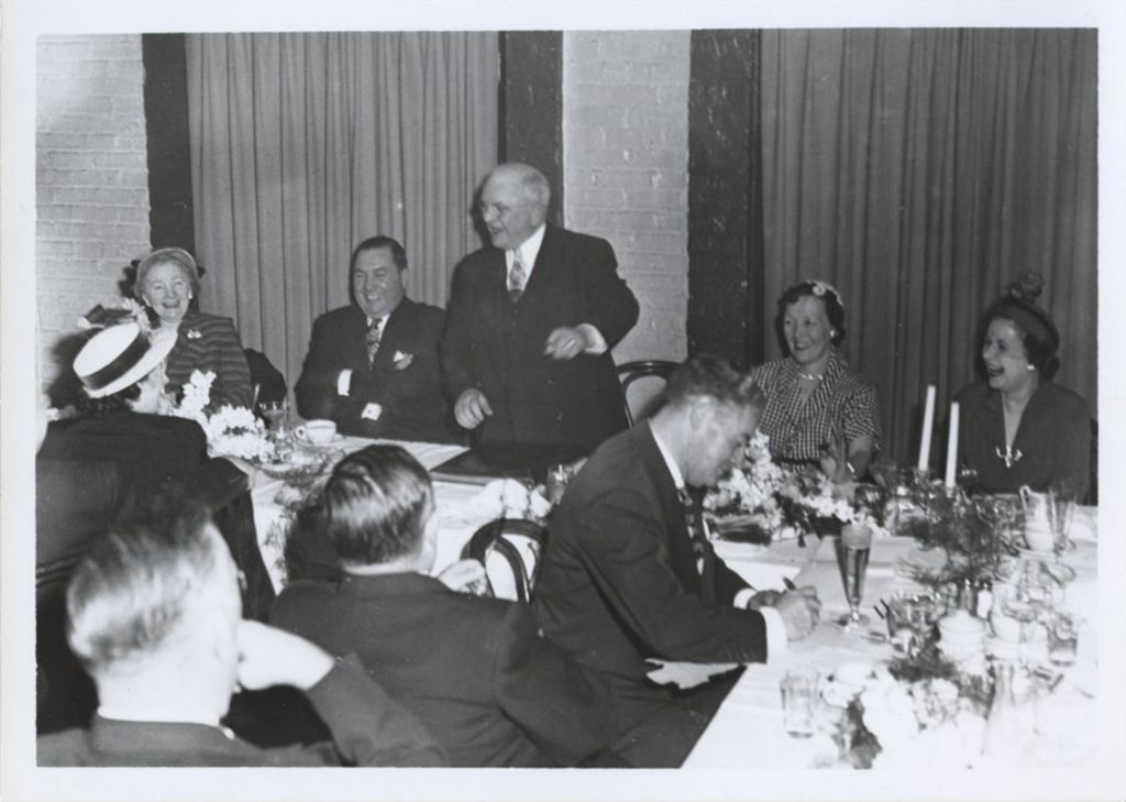 Miniature of Richard J. Daley with family members at a banquet