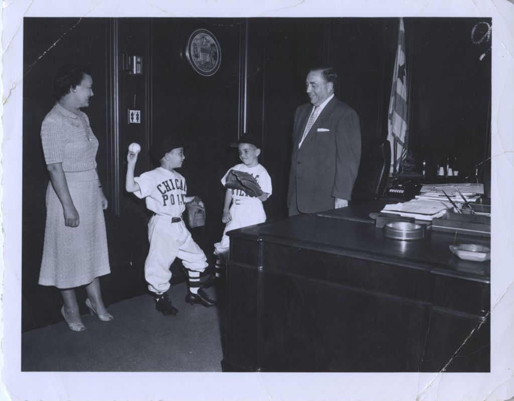 Miniature of Eleanor and Richard J. Daley with their sons in Chicago Police baseball uniforms