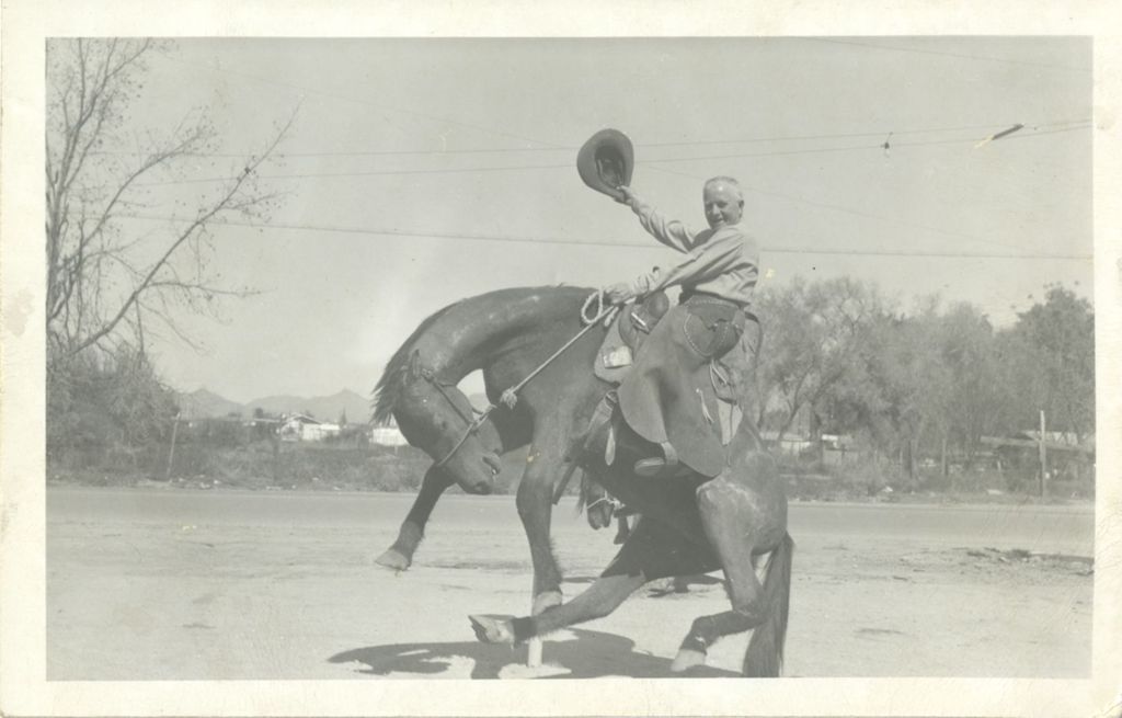 Michael J. Daley on a bronco horse statue