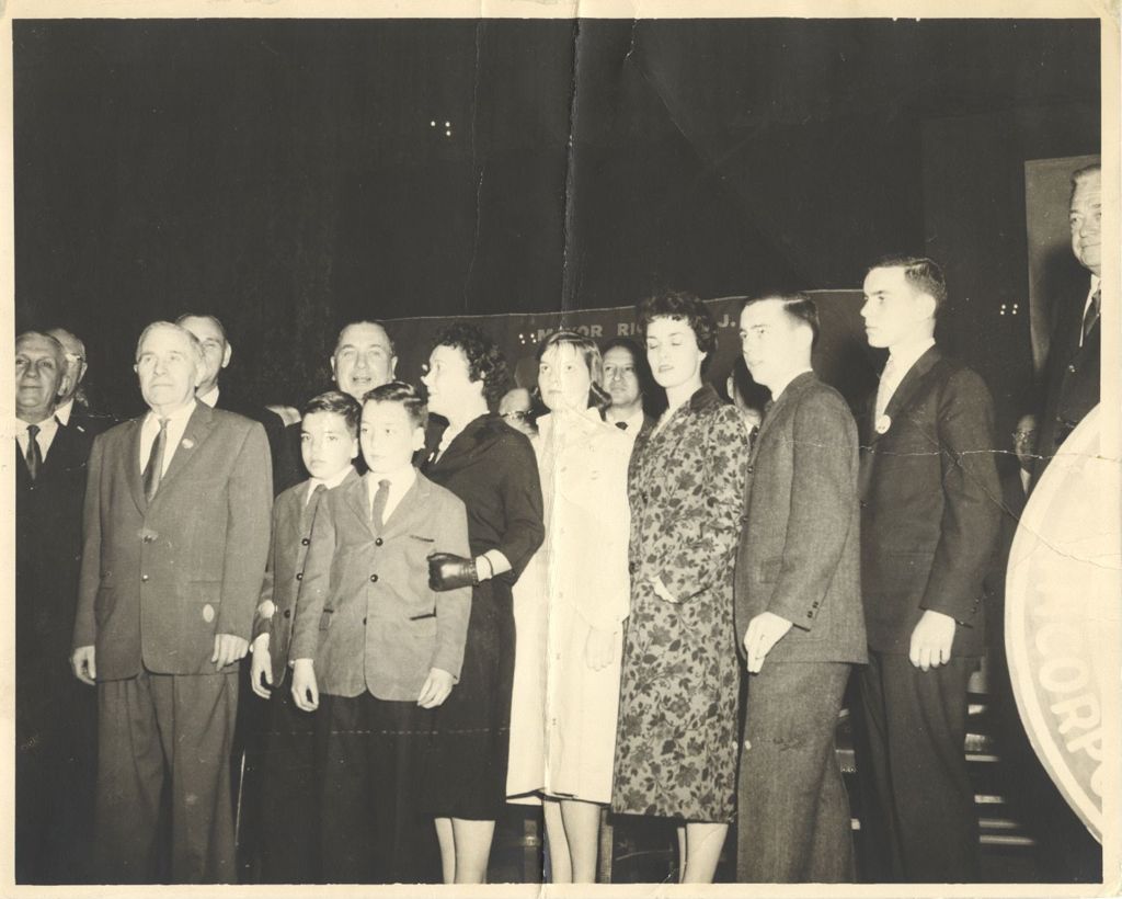 Miniature of Daley family on stage at an event