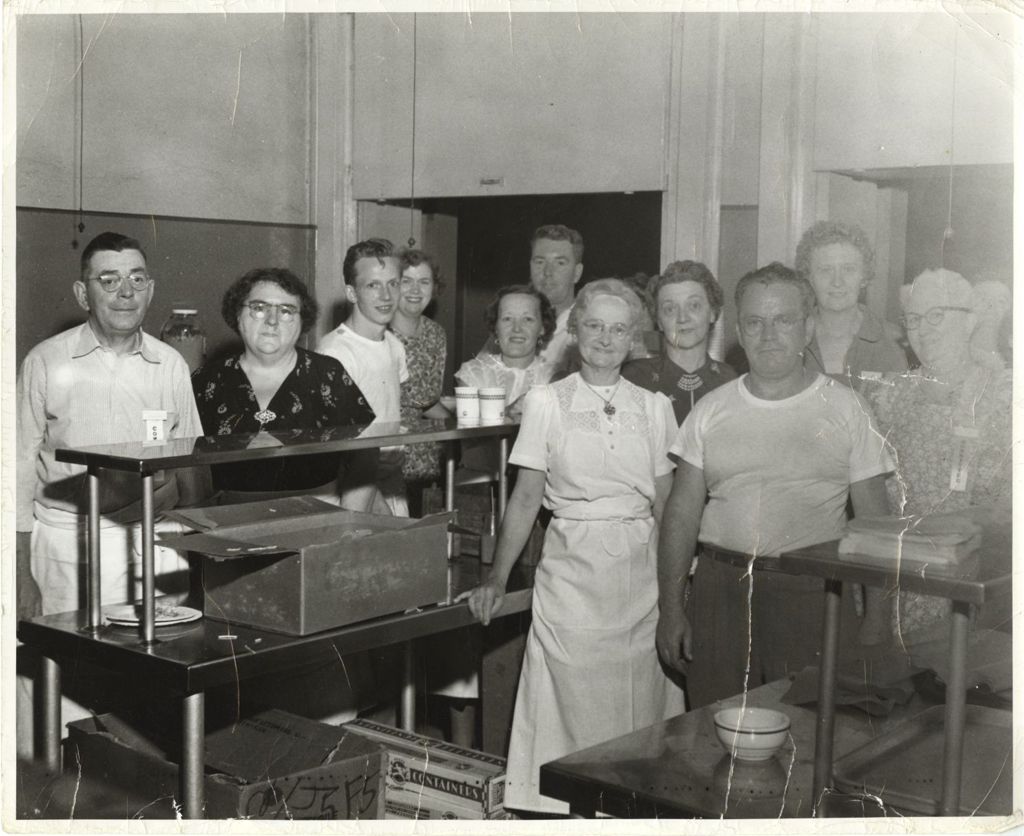 Miniature of Eleanor Daley with others in school kitchen