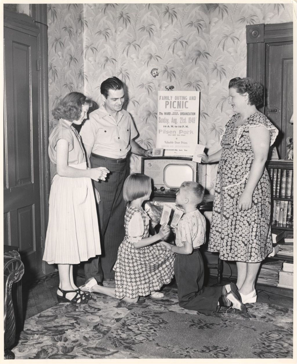Miniature of Family around an 11th Ward picnic sign