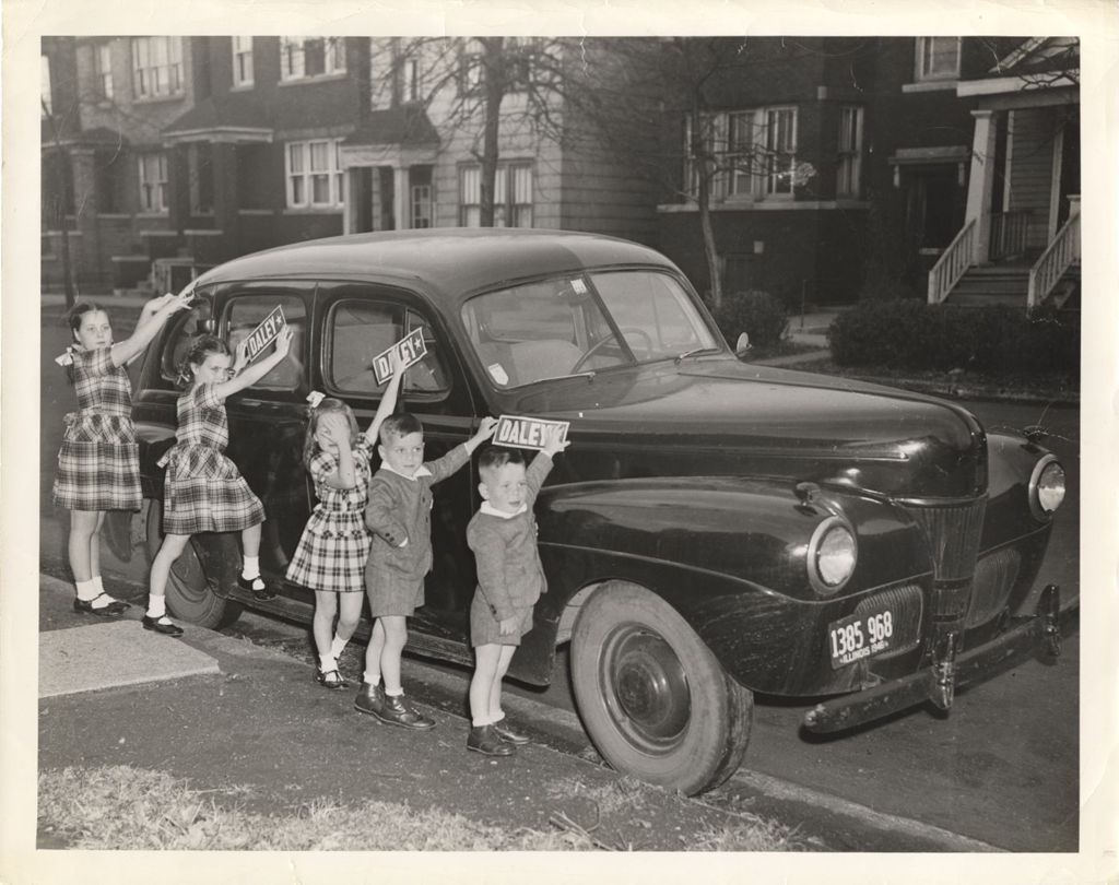 Miniature of Daley children decorating the family car with campaign stickers