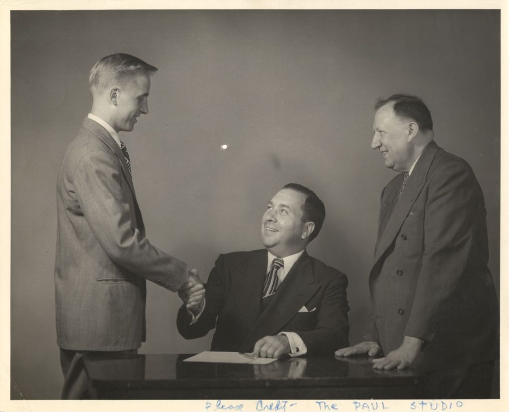 Richard J. Daley shakes hands with cadet