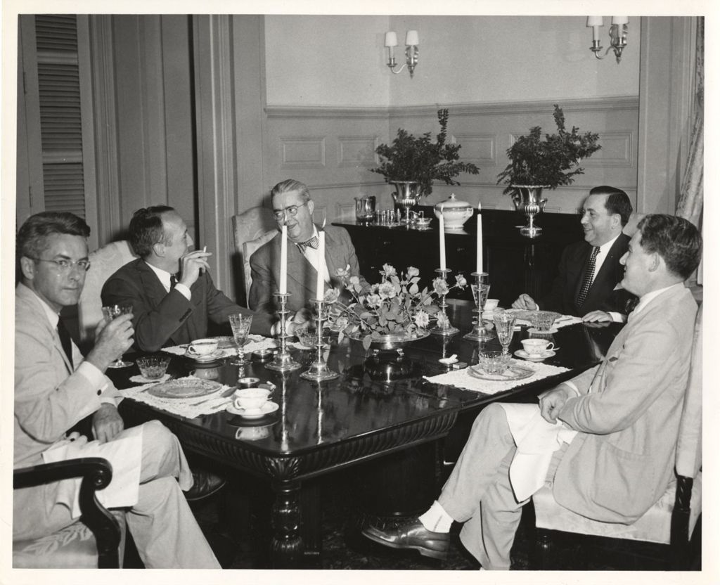 Richard J. Daley dining with others in the Illinois governor's mansion
