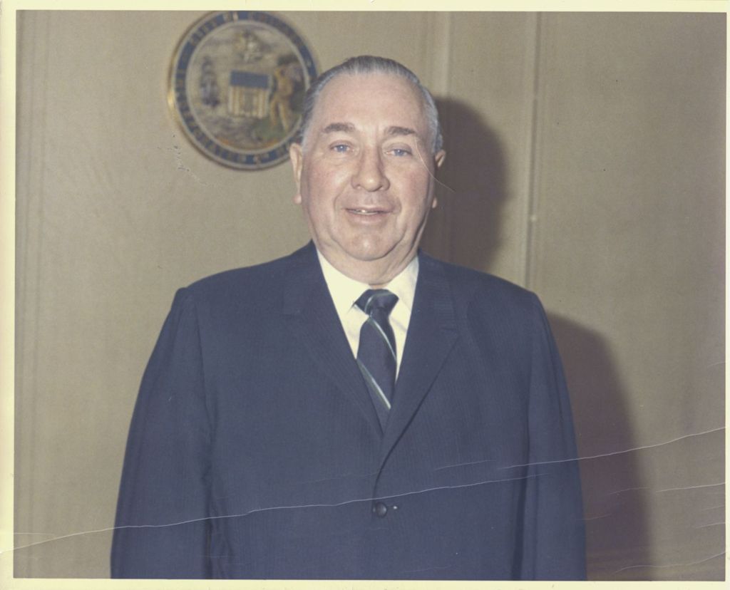 Miniature of Portraits of Richard J. Daley smiling in his City Hall office