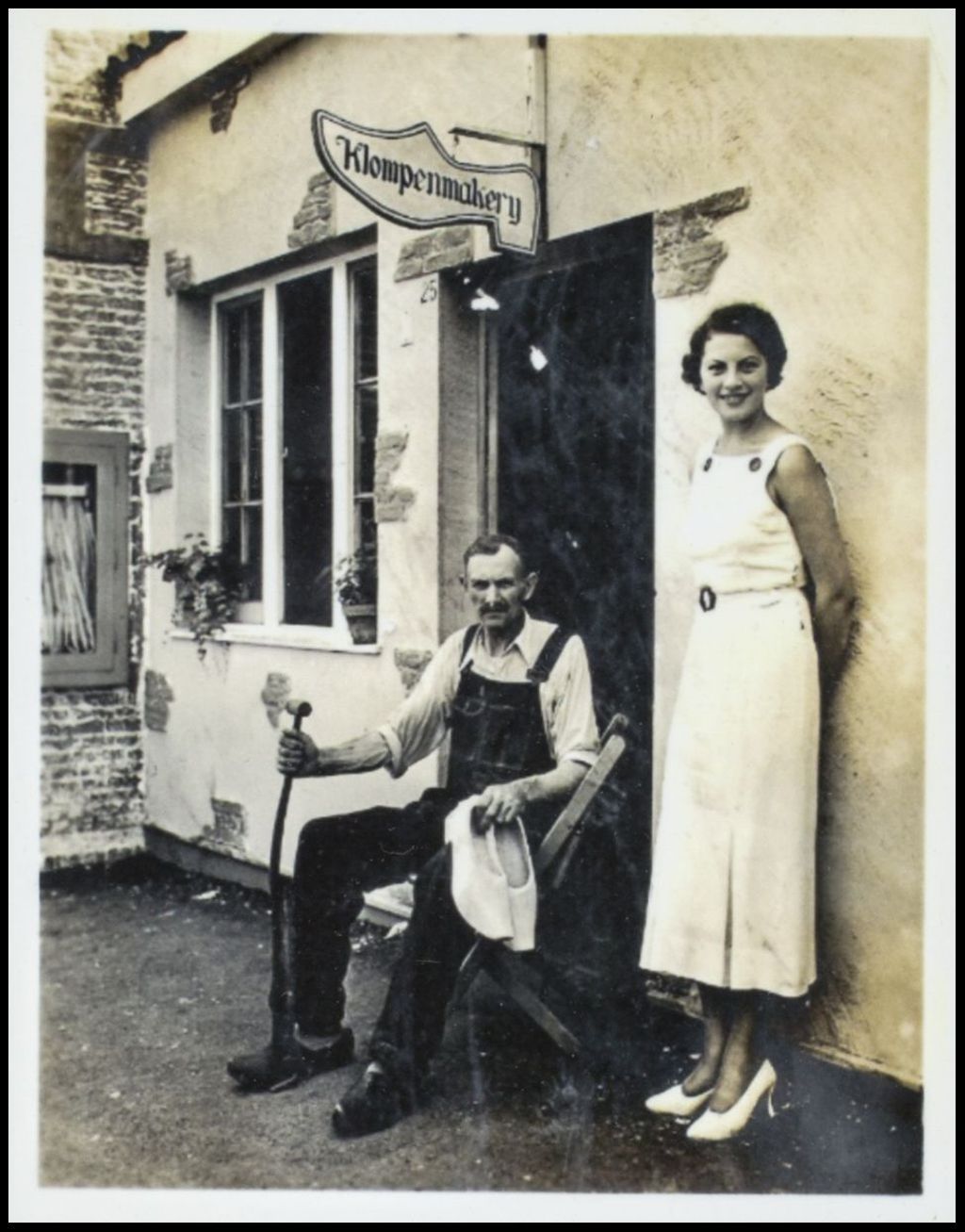 Photograph of Martha Nomden in front of Klompenmakery, Dutch Village 1933-1934