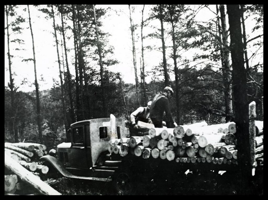 Miniature of Unidentified loggers loading timber on a flatbed truck.