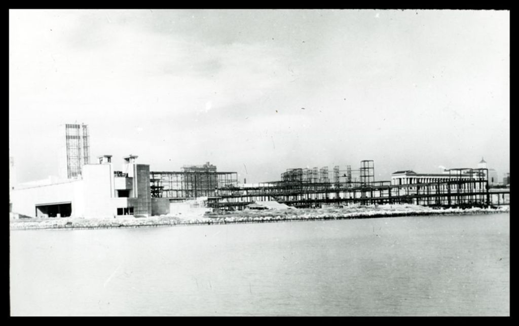 Miniature of View of Century of Progress Hall of Science from east across the lagoon while still under construction.
