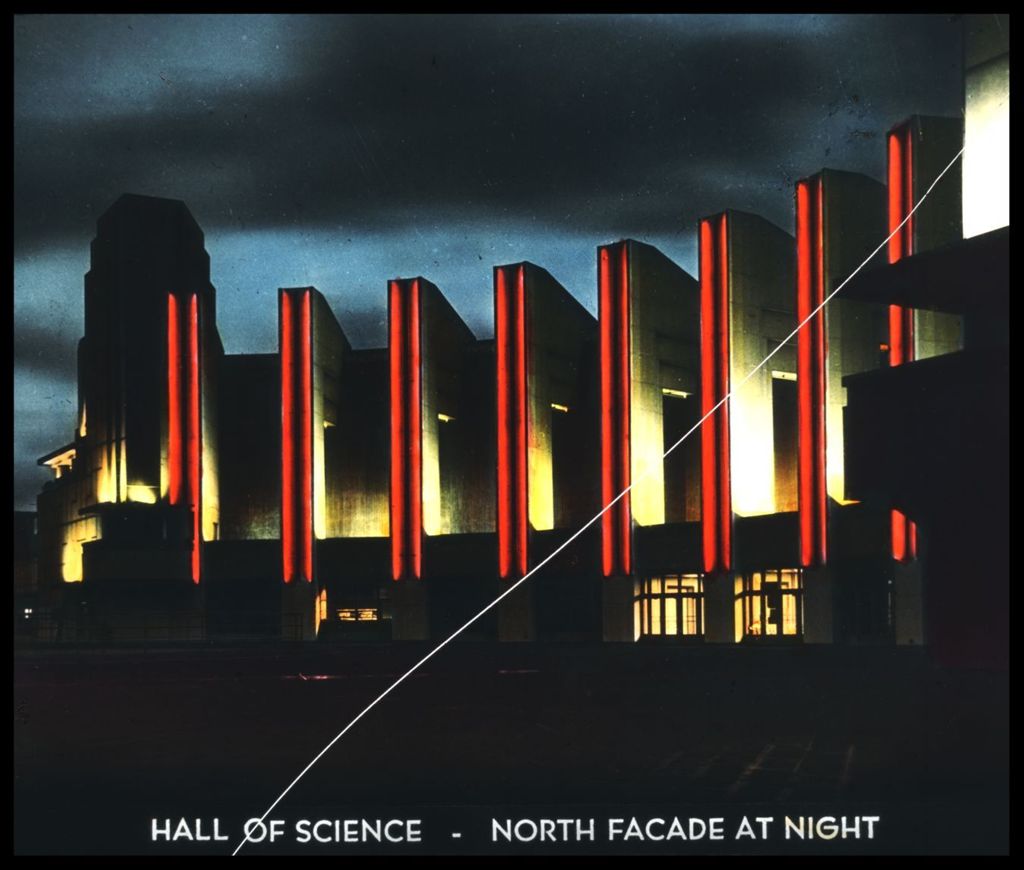 The north facade to the Hall of Science at night.