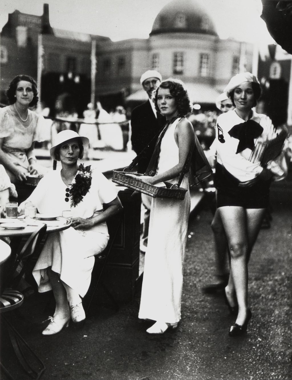 Miniature of Aimee Semple McPherson (seated on the left) at the Streets of Paris outdoor cafe
