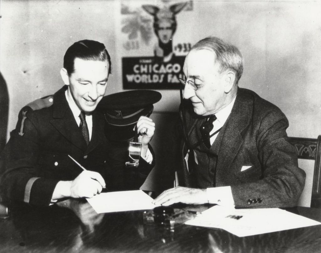 Century of Progress President Rufus C. Dawes signing papers with famed jazz musician Hal Kemp