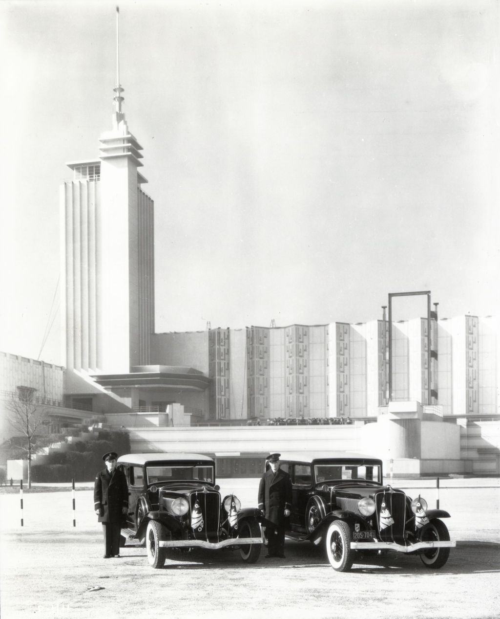 Miniature of Chauffeurs standing next to their automobiles in front of the Century of Progress Hall of Science