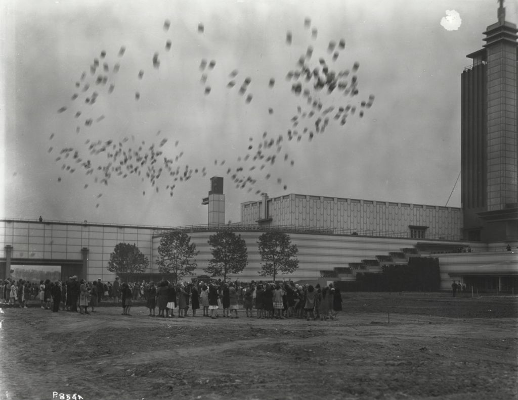 Miniature of Photo of a balloon race at the moment of launch. The northern facade of the Hall of Science building is in the background.